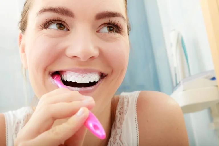 woman brushing teeth