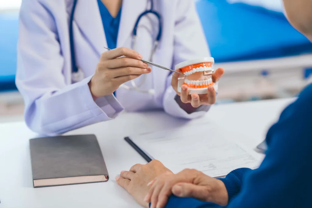 Dentists provide advice to elderly patients Female dentists provide valuable advice to elderly male patients